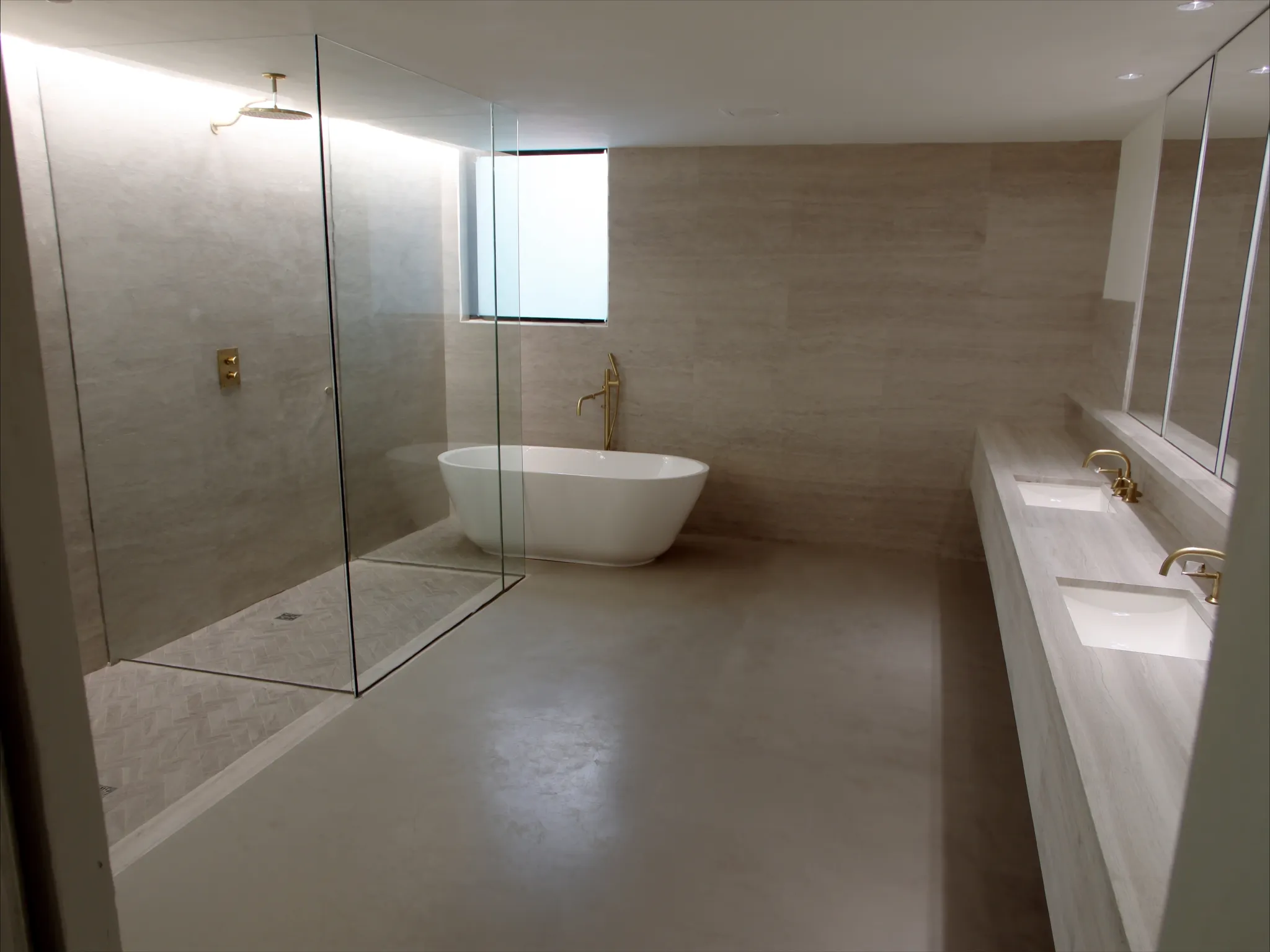 Ridgeview bathroom after renovation: curbless shower and freestanding tub