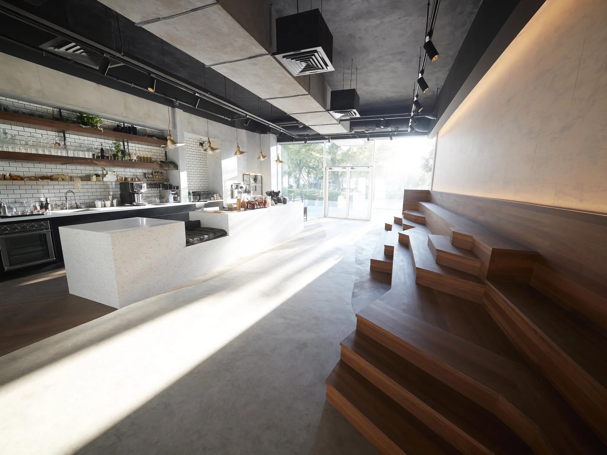 Harbourline Café fit-out: walnut banquettes, terrazzo counter, and brass pendants