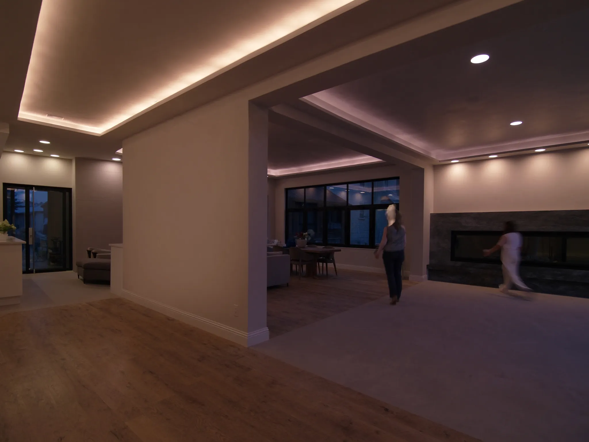 Main floor after renovation: open concept with flush beam and oak flooring
